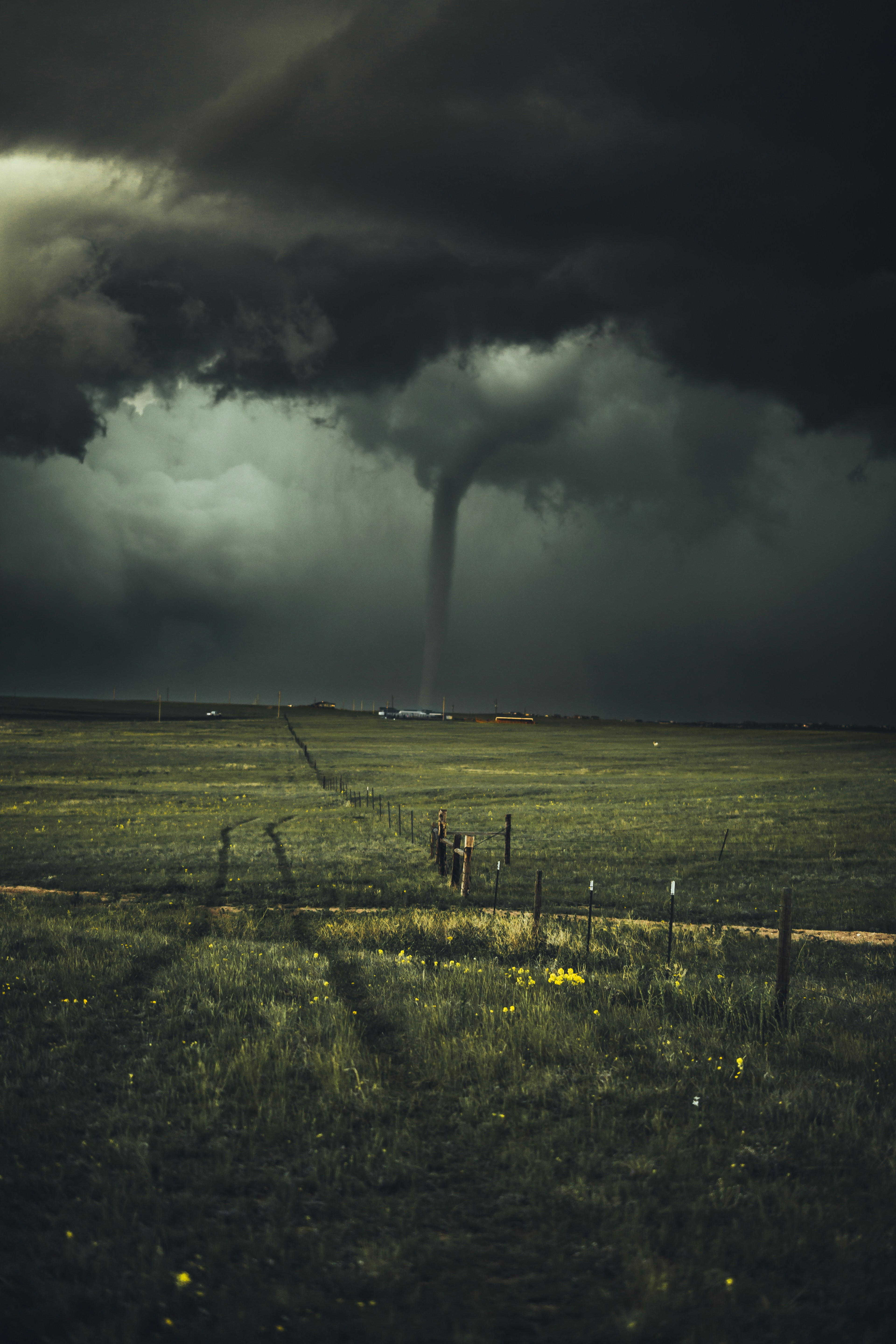dark image of a tornado in a field